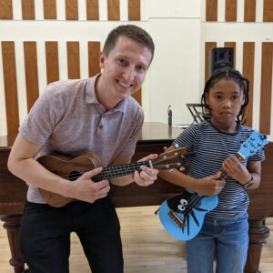 Image of ukulele teacher and student